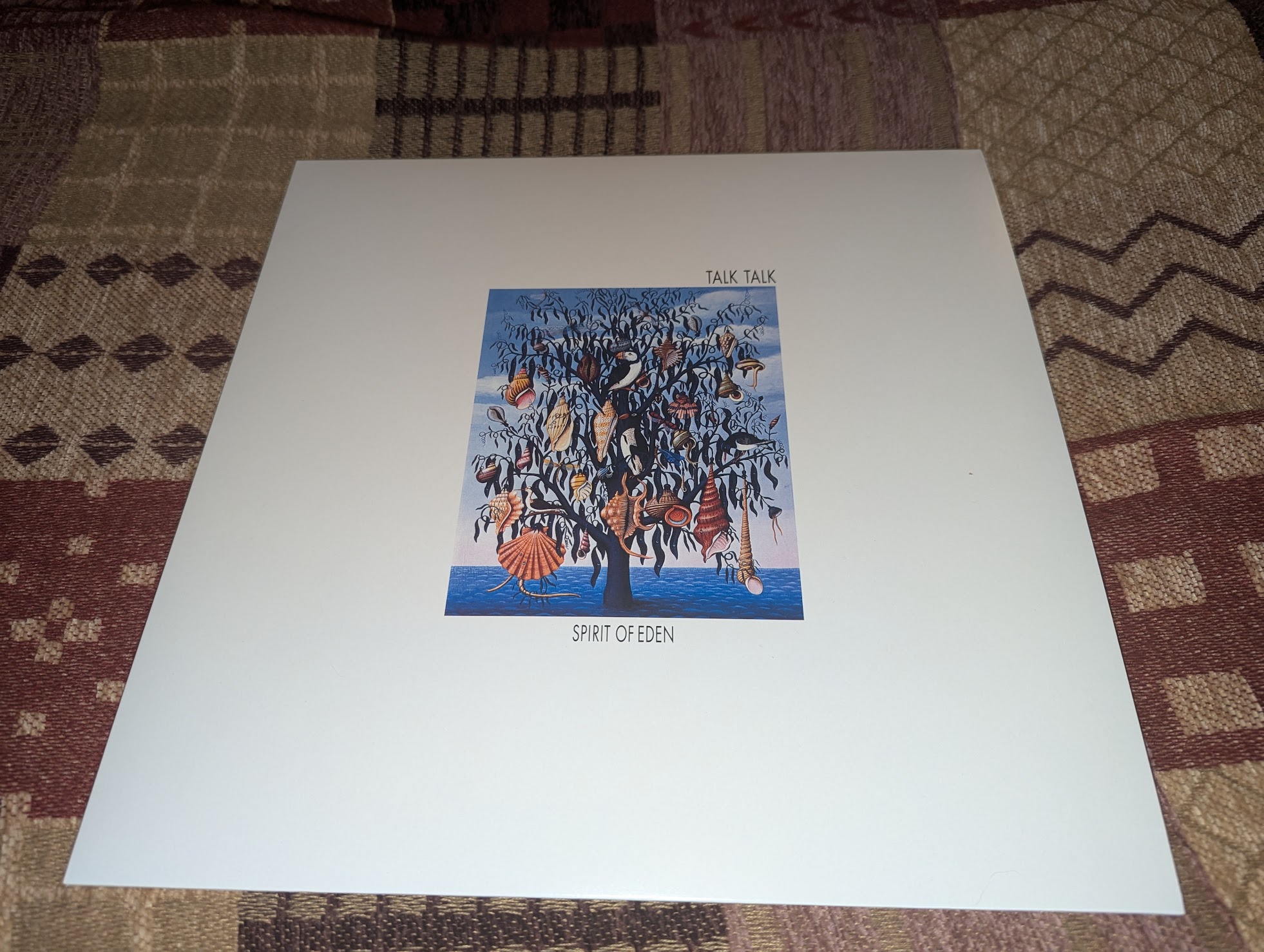 Talk Talk's Spirit of Eden record sleeve resting on patterned fabric.